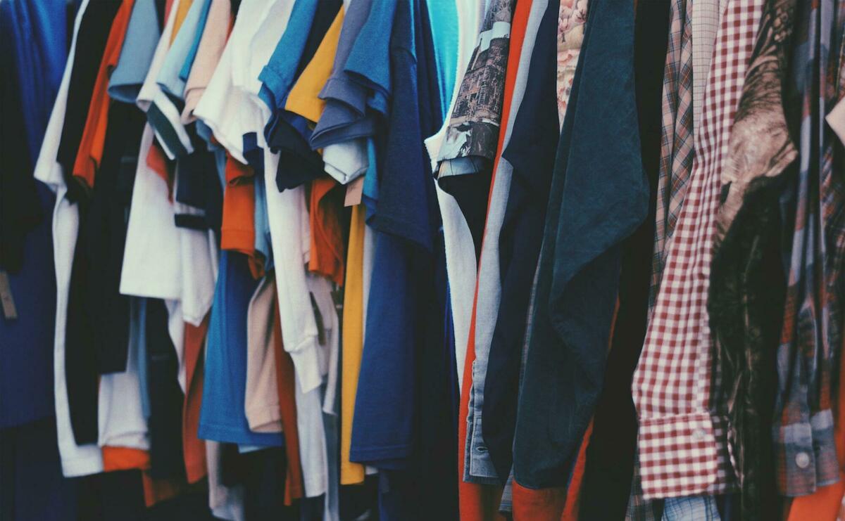 Colorful clothes are hanging on rack