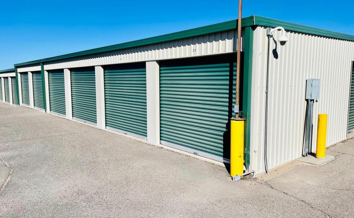 Secure storage units with gray door.