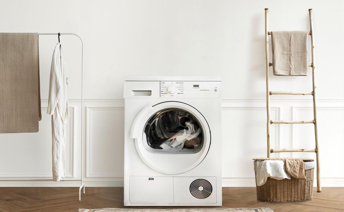 Washing machine in a minimal laundry room interior design.