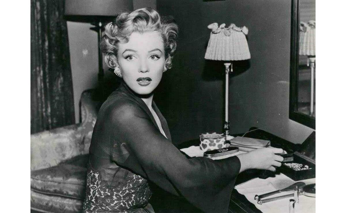 Marilyn Monroe is looking to the camera