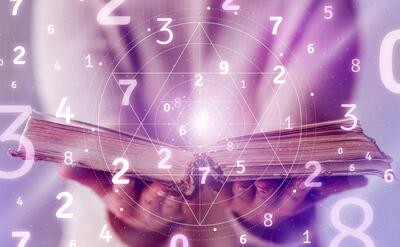 Open book with numerology concept composition.