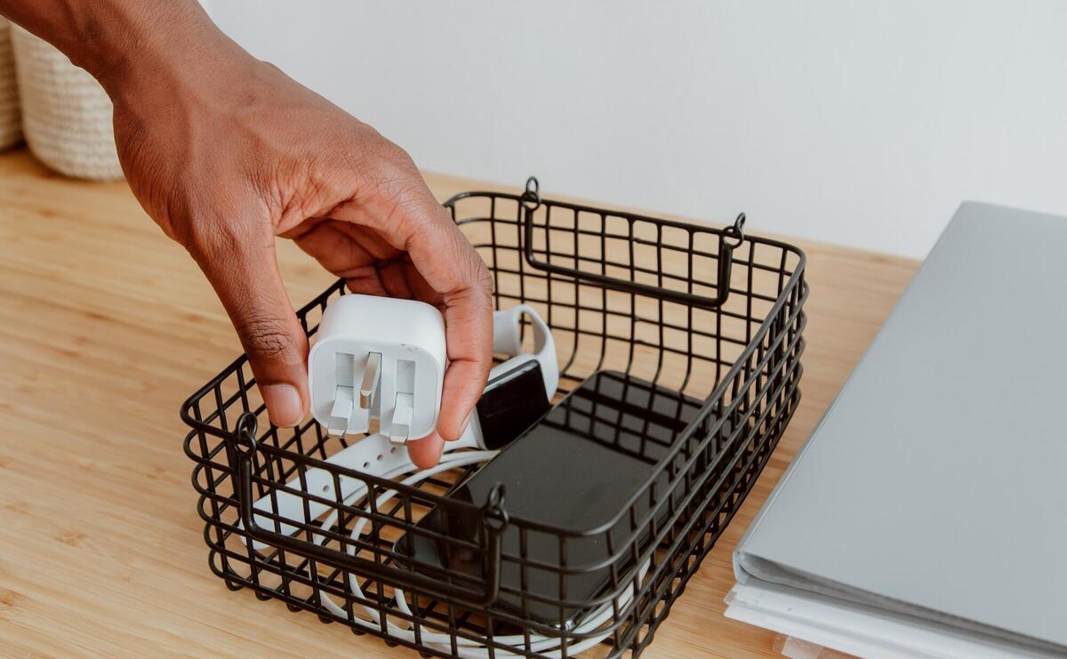 Basket with charger, smartphone and watch
