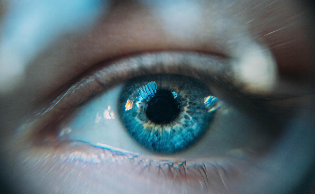 A close up photo of a blue eye.