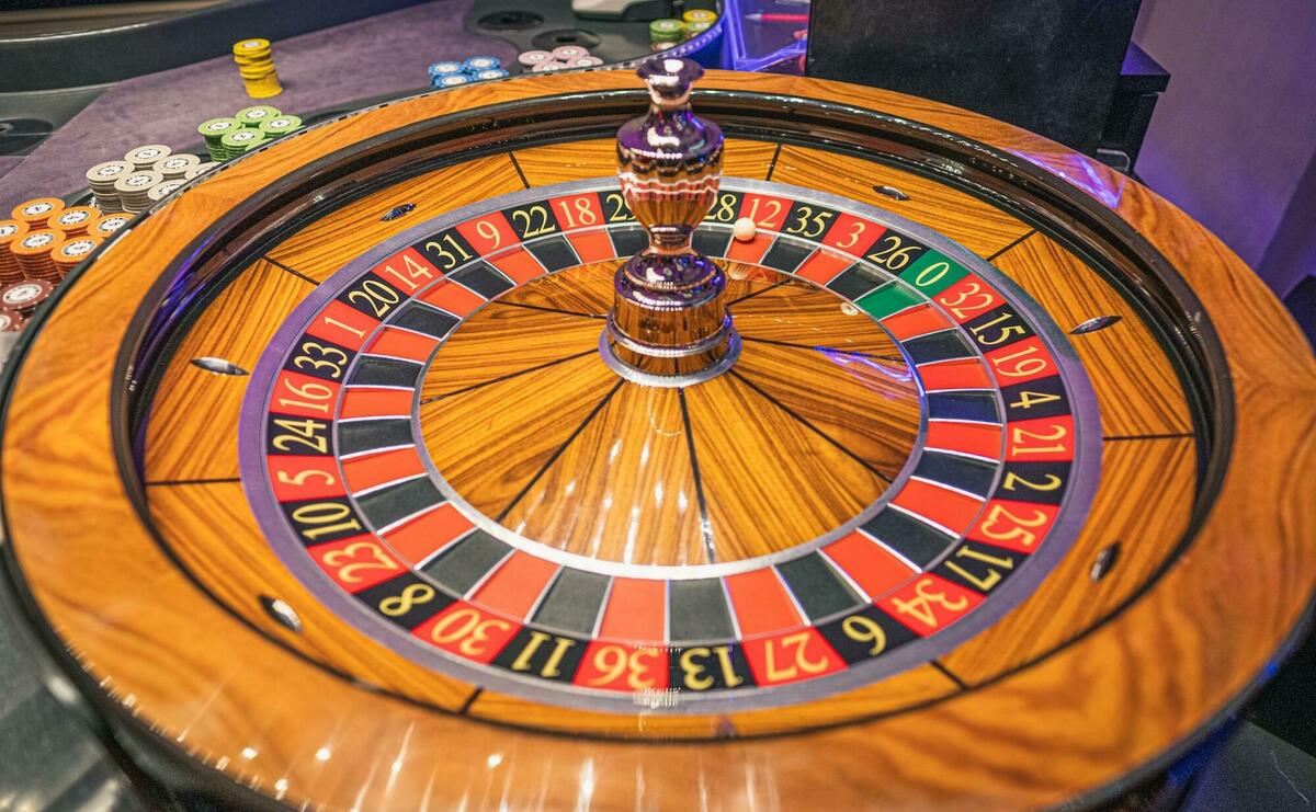 A big wooden roulette wheel.