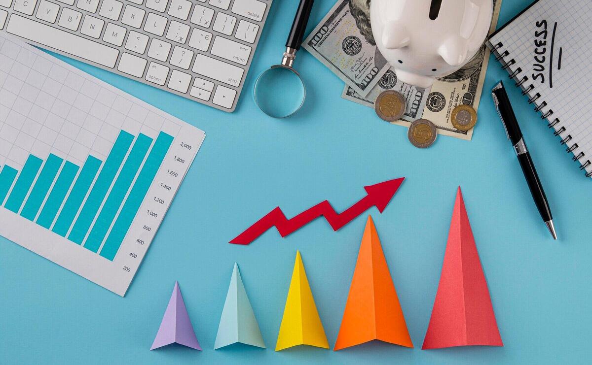 Top view of business items with growth chart and colored cones