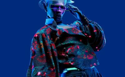 A fashion design picture, with a man wearing futuristic glasses.