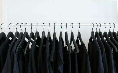 Black T-shirts on hangers